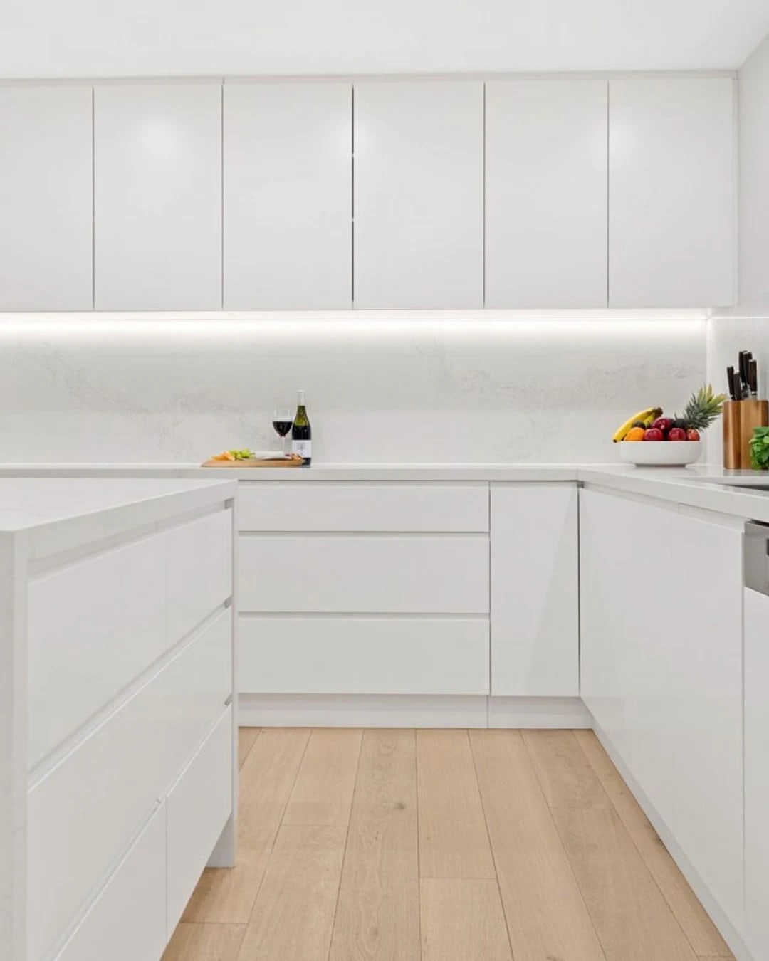 Light and airy modern kitchen featuring HW12342 Maison.